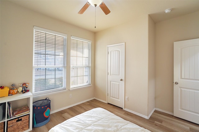 bedroom featuring ceiling fan and light hardwood / wood-style flooring