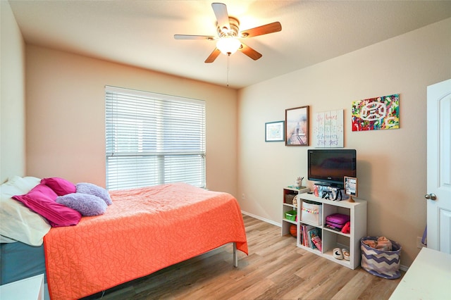 bedroom featuring ceiling fan and light wood-type flooring