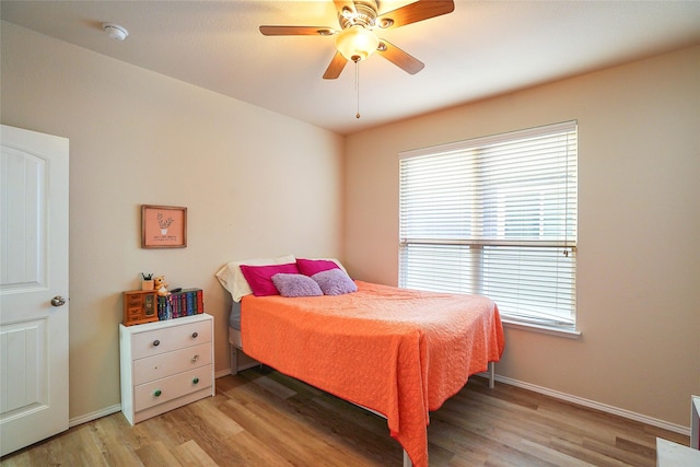 bedroom featuring ceiling fan and light hardwood / wood-style flooring