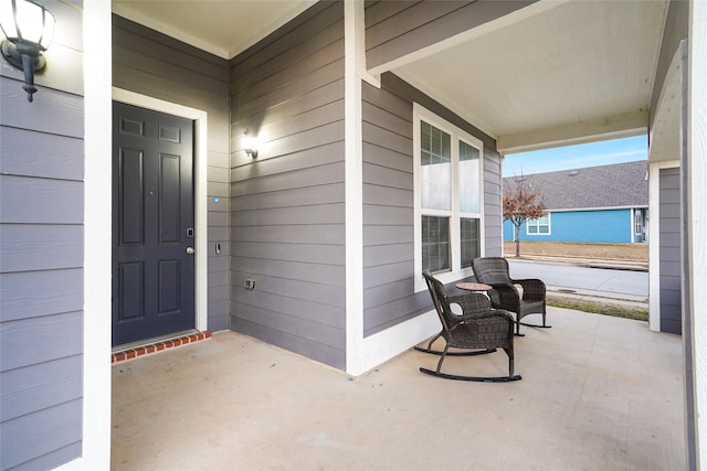 doorway to property with covered porch