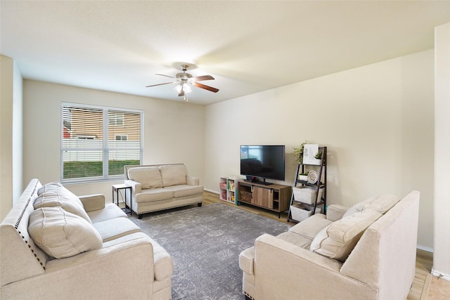 living room featuring hardwood / wood-style flooring and ceiling fan