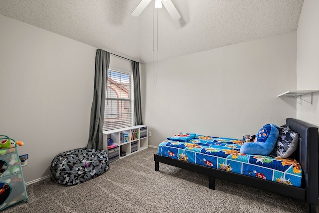 bedroom with ceiling fan, a textured ceiling, and carpet flooring