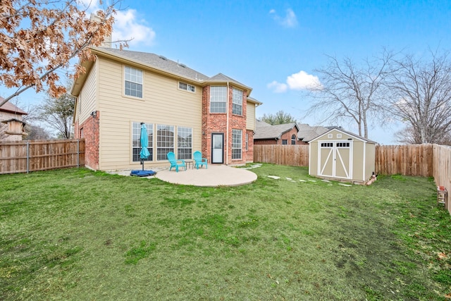 rear view of property featuring a shed, a patio area, and a lawn