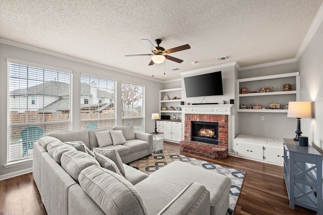 living room featuring ornamental molding, dark wood-type flooring, and a wealth of natural light