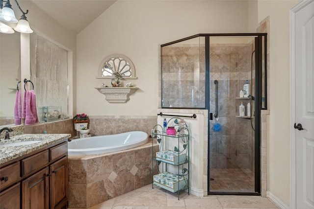 bathroom featuring vanity, vaulted ceiling, tile patterned floors, and independent shower and bath