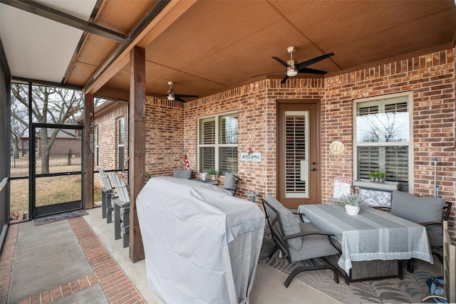 view of patio / terrace featuring ceiling fan and a grill