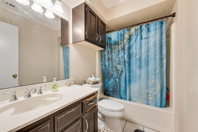 full bathroom featuring tile patterned flooring, vanity, toilet, and shower / bath combo with shower curtain