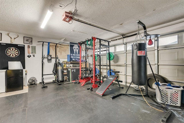 exercise room featuring a textured ceiling