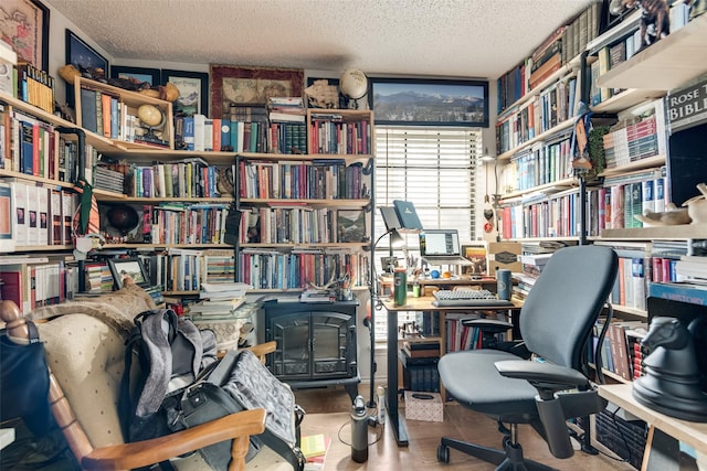 office featuring wood-type flooring and a textured ceiling