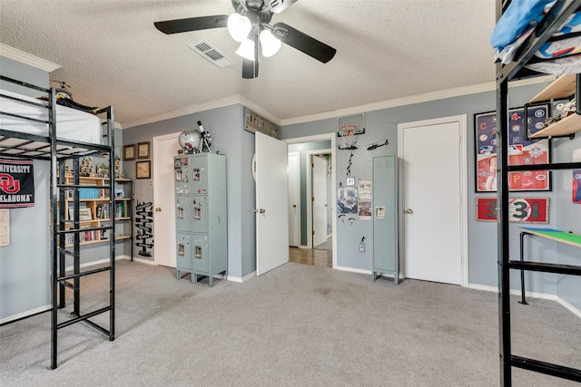 unfurnished bedroom featuring crown molding, carpet, ceiling fan, and a textured ceiling