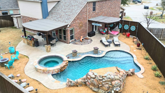 view of pool featuring an in ground hot tub and a patio