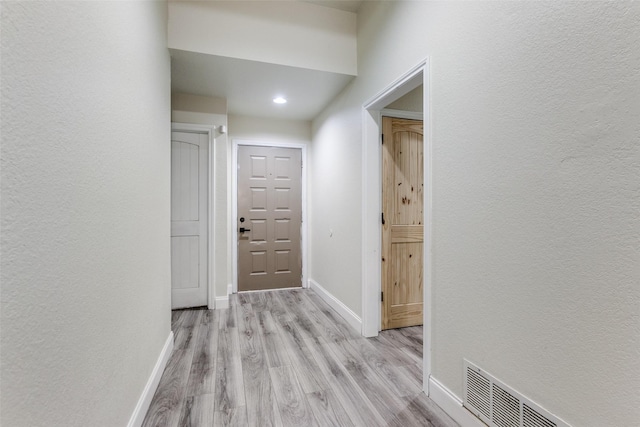 corridor featuring light wood-type flooring