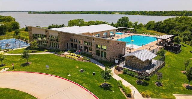 birds eye view of property featuring a water view