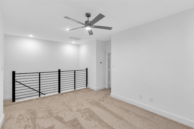 carpeted empty room with ceiling fan