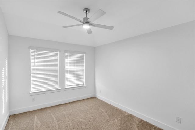 unfurnished room featuring light carpet and ceiling fan