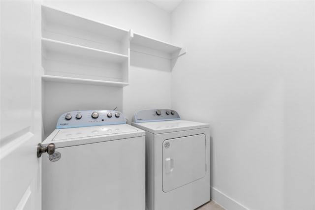 laundry room featuring washing machine and clothes dryer