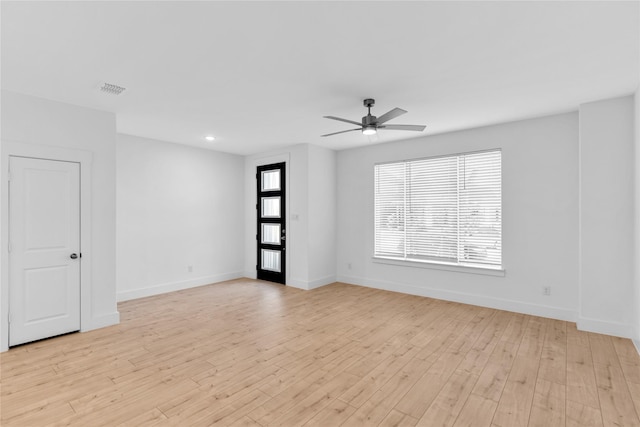 unfurnished room featuring light hardwood / wood-style floors and ceiling fan