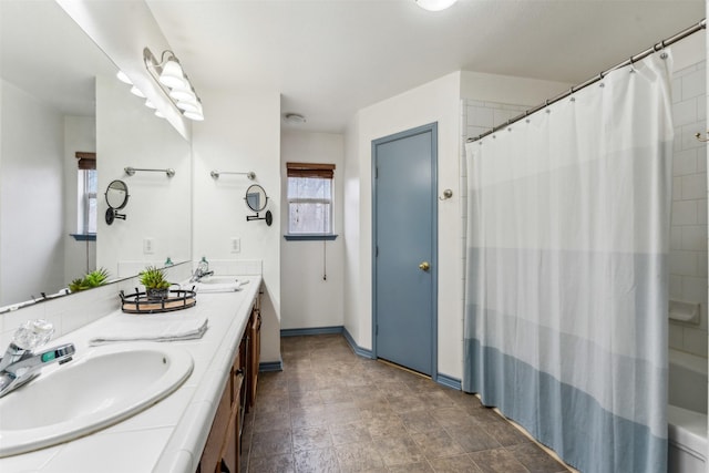 bathroom featuring double vanity and a sink