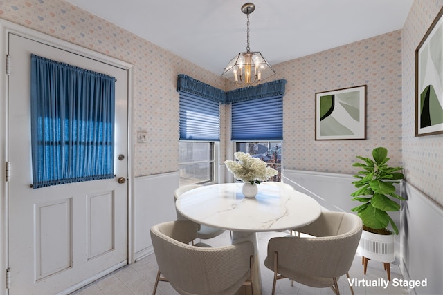 dining area featuring an inviting chandelier and light tile patterned flooring