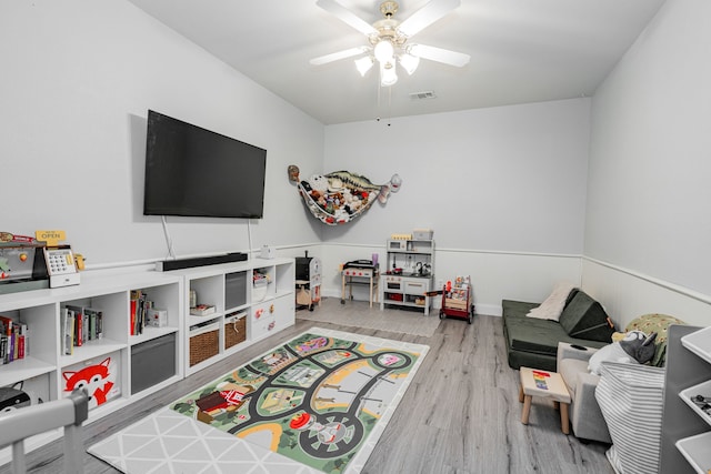 recreation room featuring ceiling fan and wood-type flooring