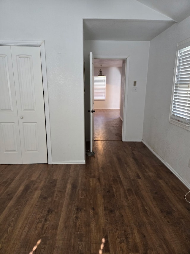 corridor featuring dark hardwood / wood-style flooring