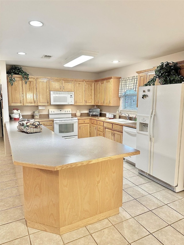 kitchen featuring white appliances, light tile patterned floors, sink, and light brown cabinets