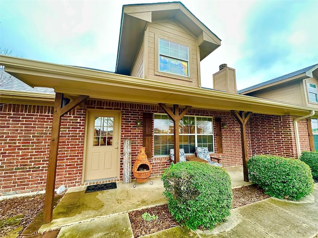 doorway to property featuring a porch