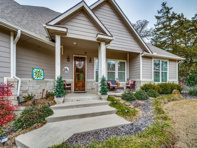 doorway to property featuring a porch