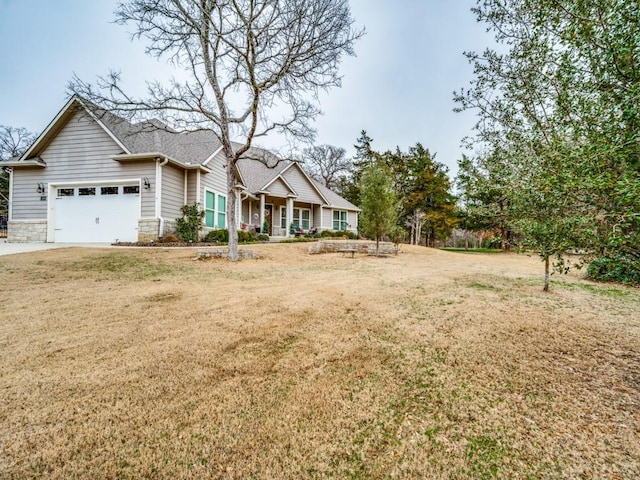 view of front facade featuring a garage and a front lawn