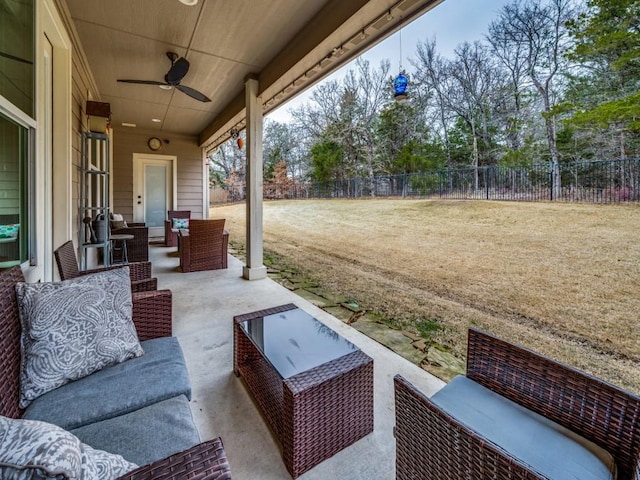 view of patio / terrace featuring ceiling fan and an outdoor living space