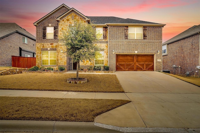 front of property with a garage