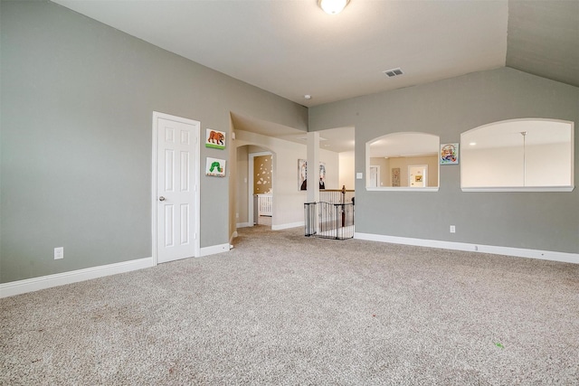 interior space with lofted ceiling and carpet flooring