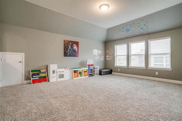 game room featuring carpet floors and vaulted ceiling