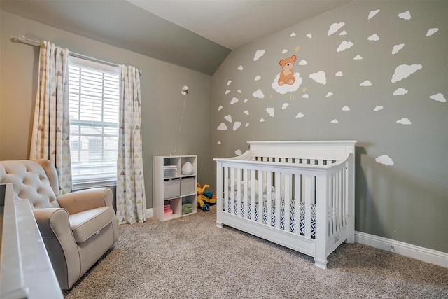 carpeted bedroom featuring vaulted ceiling and a nursery area