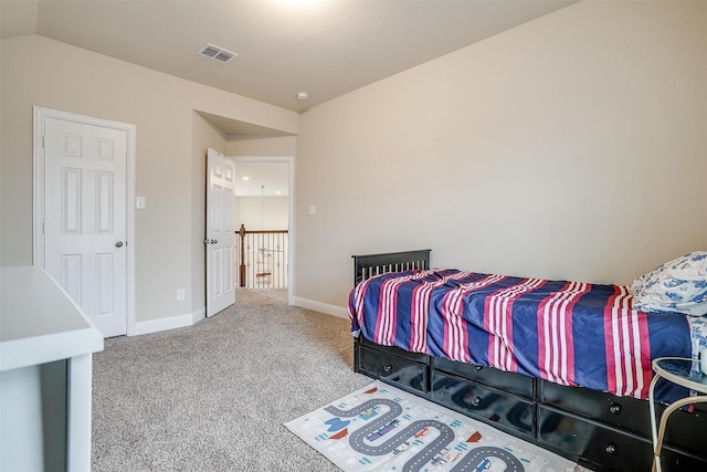 carpeted bedroom featuring vaulted ceiling