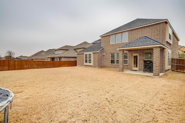 rear view of house featuring a patio