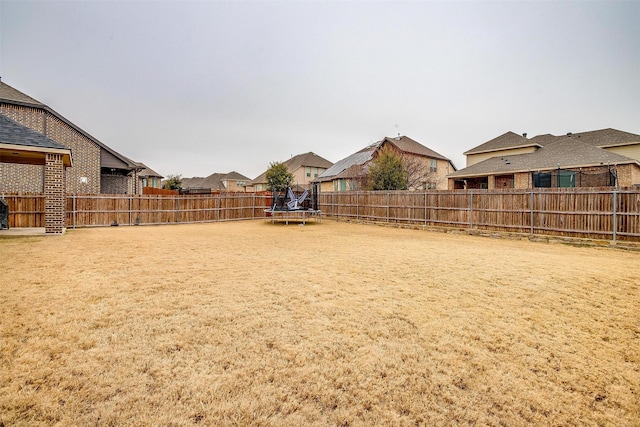 view of yard with a trampoline