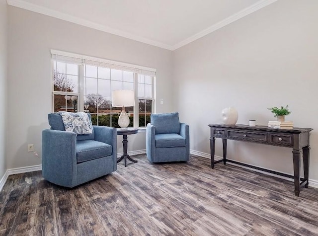 sitting room with crown molding and dark hardwood / wood-style floors