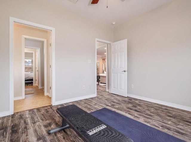 unfurnished bedroom with ceiling fan and hardwood / wood-style floors