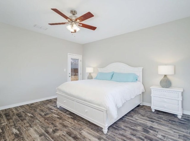 bedroom with ceiling fan and dark hardwood / wood-style flooring