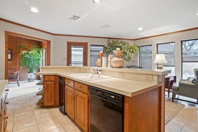 kitchen with an island with sink, black dishwasher, sink, and crown molding