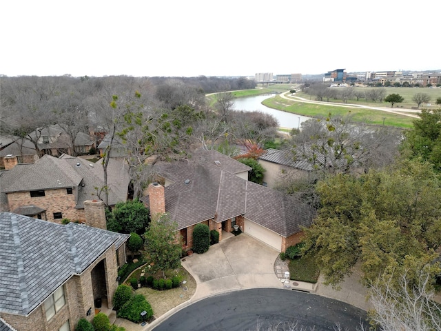 birds eye view of property featuring a water view