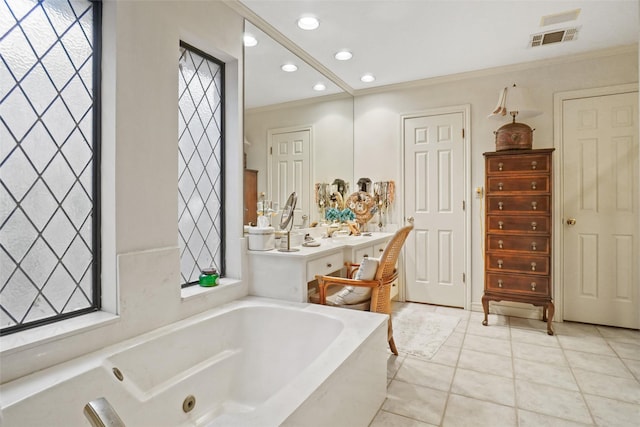 bathroom featuring crown molding, tile patterned floors, and a tub