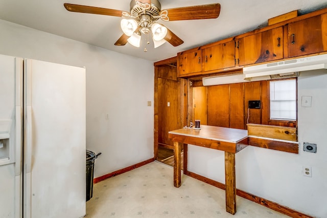 kitchen with white fridge with ice dispenser and ceiling fan