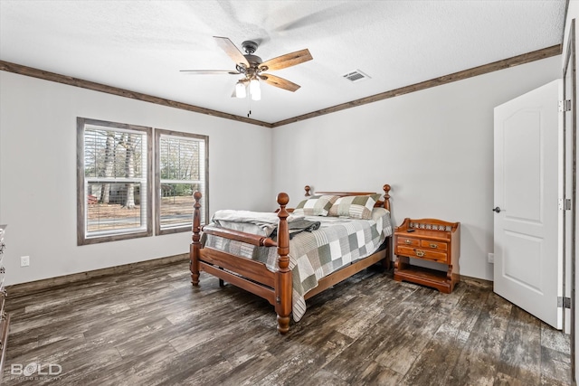 bedroom featuring dark hardwood / wood-style flooring, ceiling fan, ornamental molding, and a textured ceiling