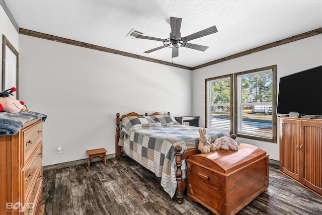 bedroom with dark wood-type flooring, ceiling fan, ornamental molding, and a textured ceiling