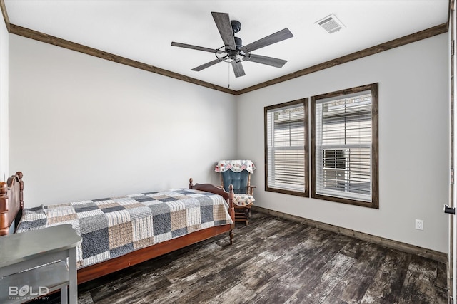 bedroom with crown molding, dark wood-type flooring, and ceiling fan