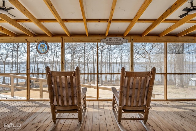 sunroom featuring ceiling fan