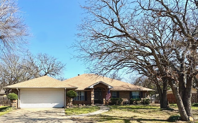 single story home with a garage and a front yard