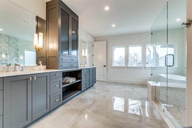 bathroom featuring vanity and separate shower and tub